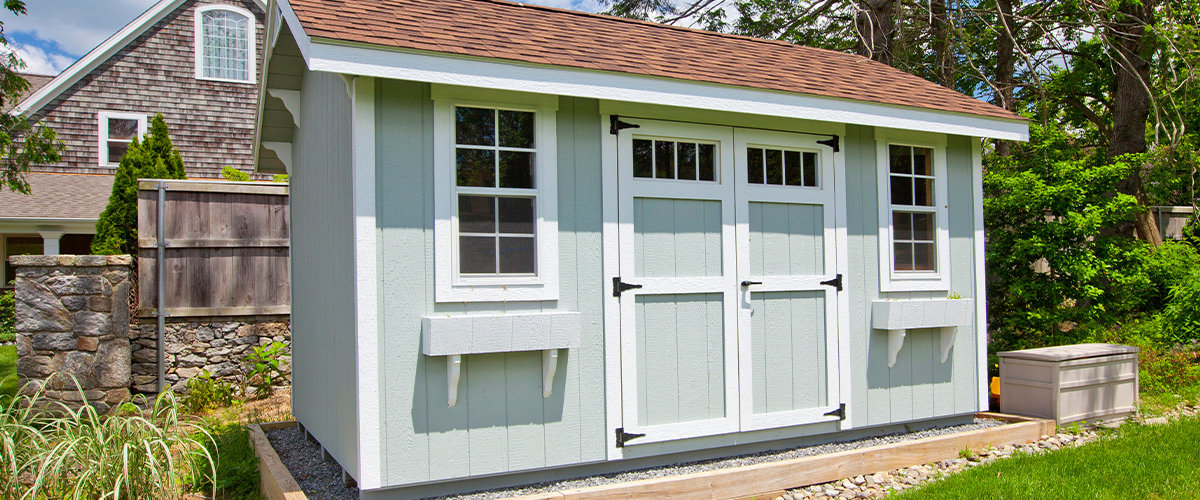 Green shed in backyard